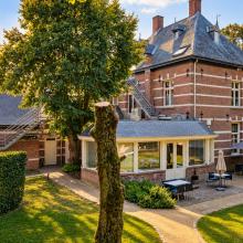 Hotel Roosendaelhof met de tuinzijde en het terras