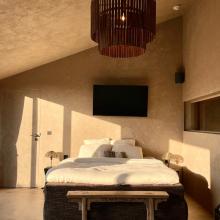 Een van de hotelkamers van Hoeve La Cascina
